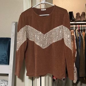 Rust colored sweater with gold sequin detail